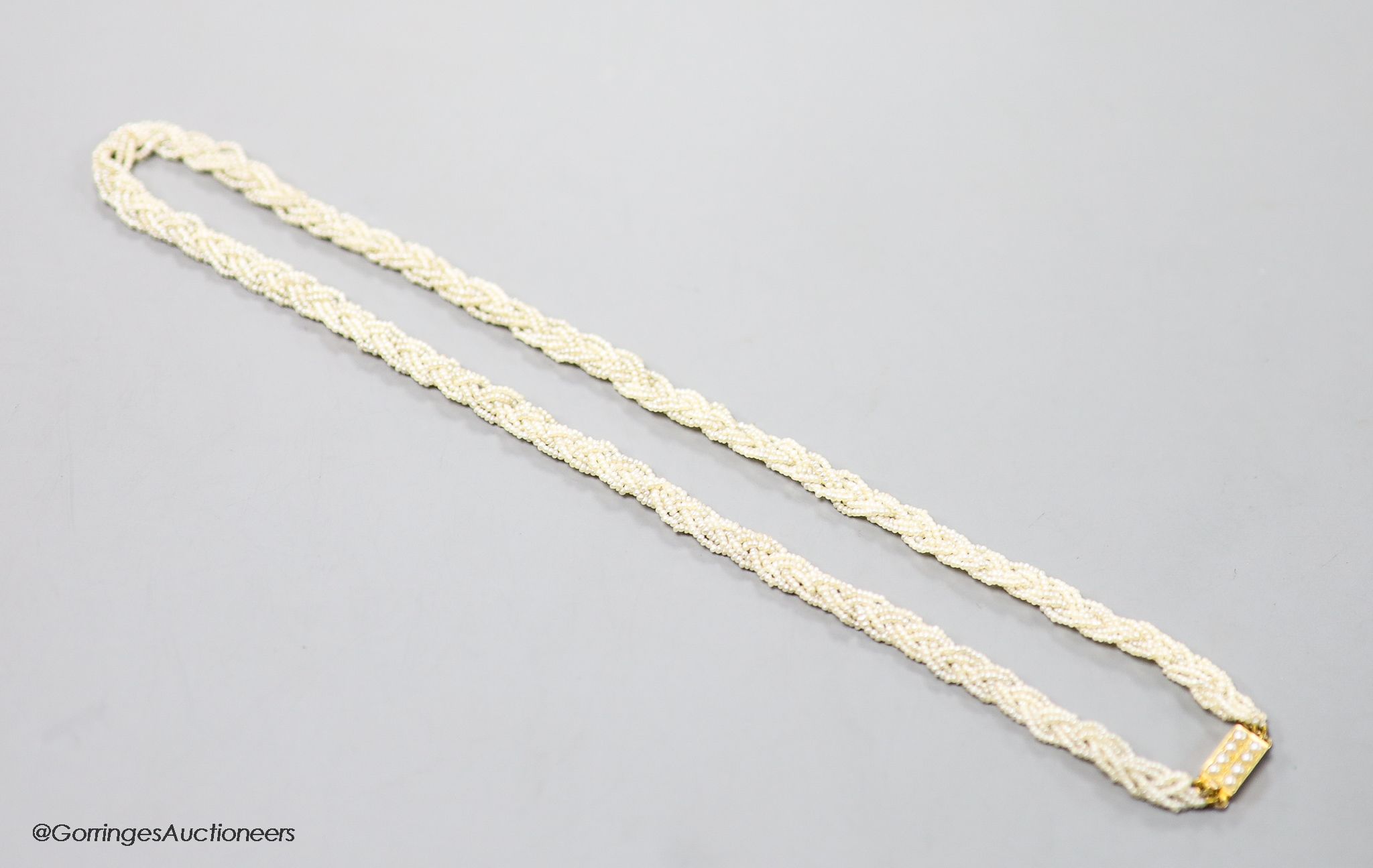 A 19th century 15ct and interwoven seed pearl choker necklace, 38cm.